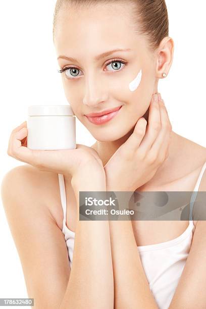 Cute Woman Applying Cream To Her Face Stock Photo - Download Image Now - Adult, Adults Only, Aging Process