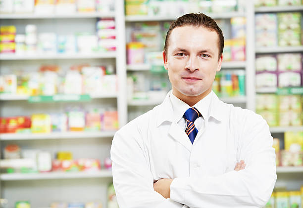 istock Confident pharmacy chemist man in drugstore 178632521