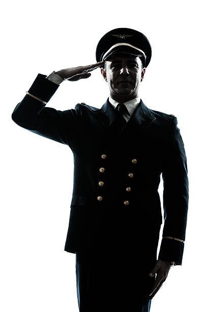 istock man in airline pilot uniform silhouette saluting 178632568