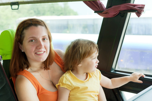 Mother and child traveling in commercial bus