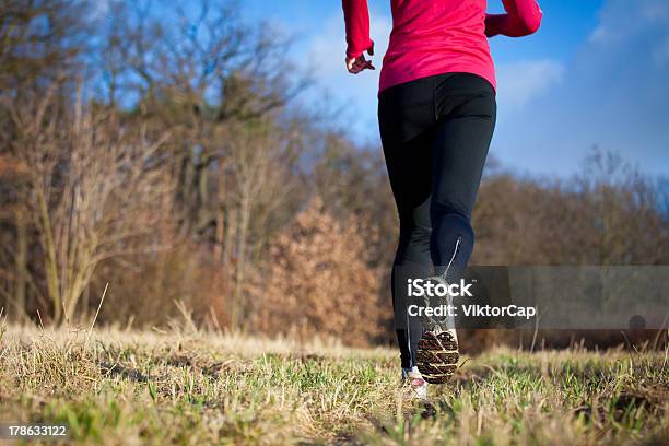 Jogging Outdoors In A Meadow Stock Photo - Download Image Now - Active Lifestyle, Activity, Adolescence
