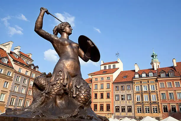 "Warsaw's mermaid statue located in the center of Old Town square. Warsaw's Old Town Market Place is the center and oldest part of the Old Town of Warsaw, capital of Poland. Immediately after the Warsaw Uprising, it was systematically blown up by the German Army."