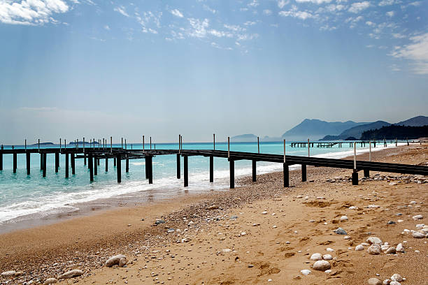 istock Beach with pier at the mediterranean sea 178633490