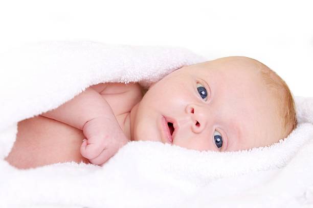 Cтоковое фото Ребенок в белым полотенцем