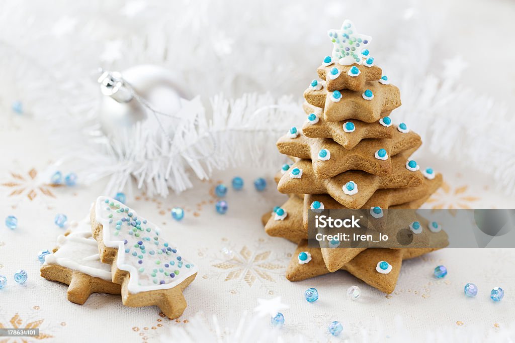Christmas Fir tree background Christmas background. Ginger and Honey Fir tree with white decoration and blue beads Art And Craft Stock Photo