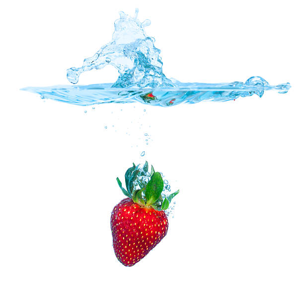 istock Fresh Strawberry Dropped into Water with Splash 178634196