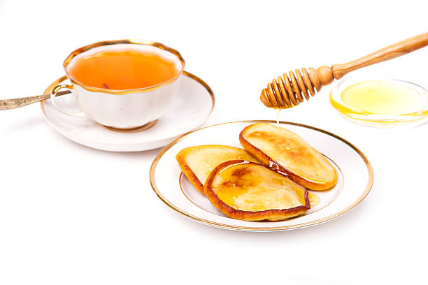 istock Pancakes with honey and tea 178634641