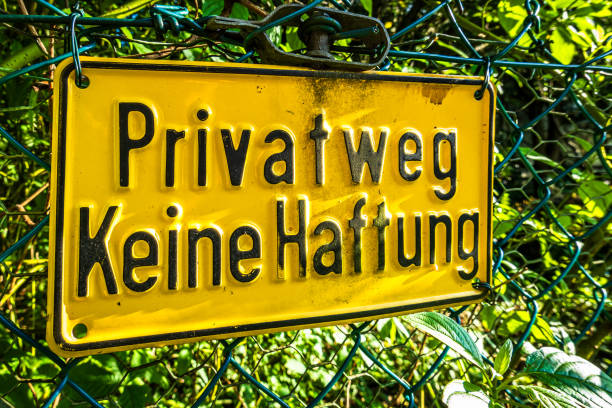 Private sign situated at the end of a hedged path
