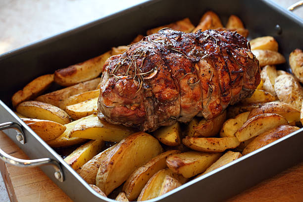 Roast of lamb with potatoes stock photo