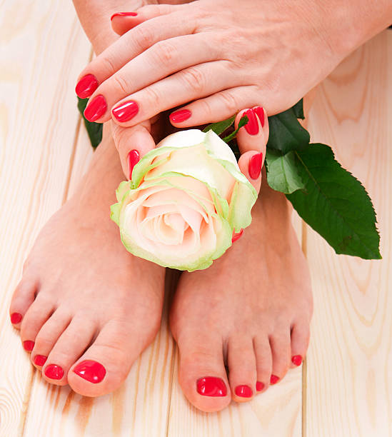 istock red manicure and pedicure, white rose 178635397