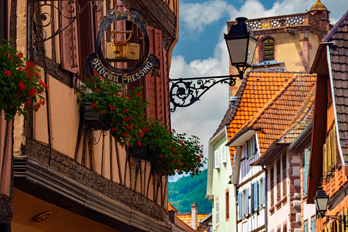 Colorful half timbered building in the streets of the beautiful Alsace village Ribeauvillé