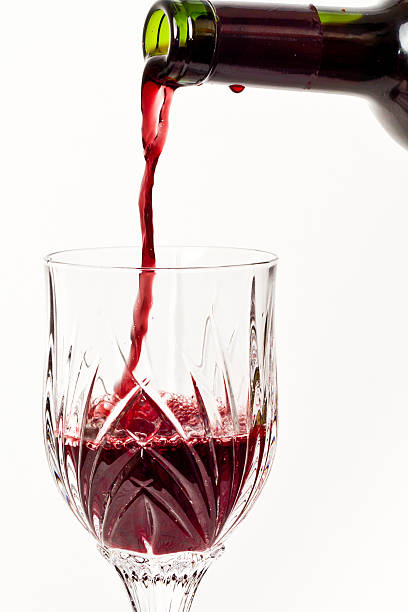 istock Pouring Red wind into a crystal glass 178636535