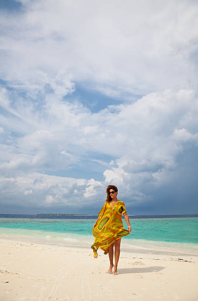 istock Young woman relaxing on beach 178637177