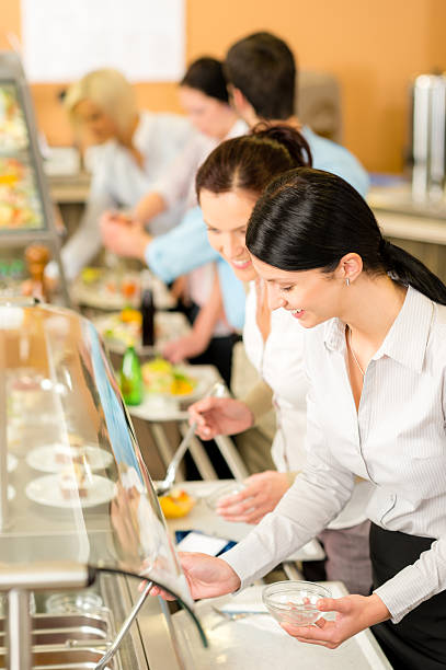 istock Cafeteria lunch two office woman choose food 178637236