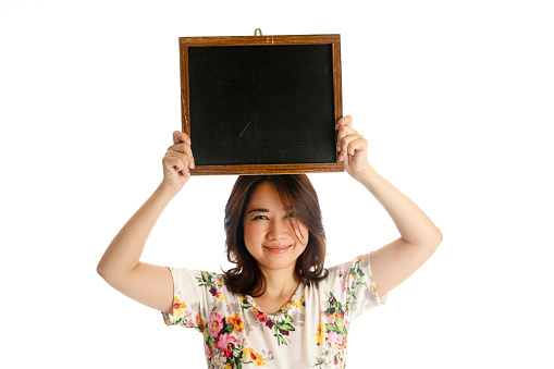 Happy Asian woman hoding blackboard isolated on white background