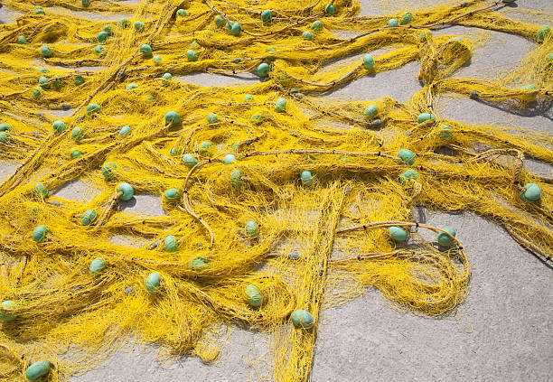 yellow fishing net stock photo