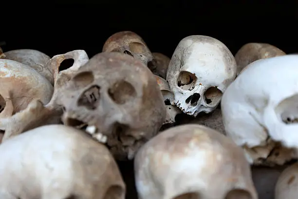 "Heap of human skulls, skeletal remains at the ossuary  in Cambodia"