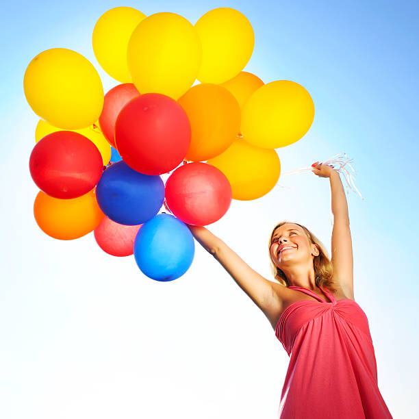 istock Woman with balloons 178638190