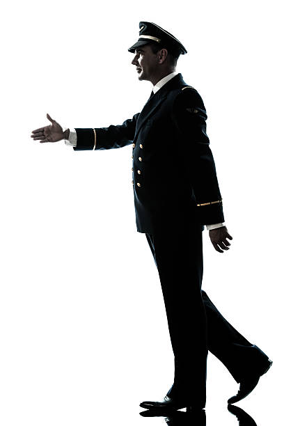 istock man in airline pilot uniform silhouette walking handshake 178638261
