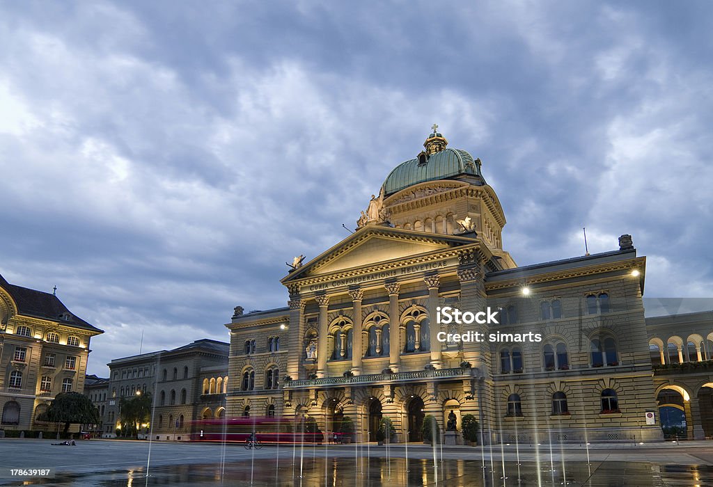 Federal Palace of Switzerland Front view of the Federal Palace of Switzerland (Bundeshaus) on a rainy evening. Bern Stock Photo