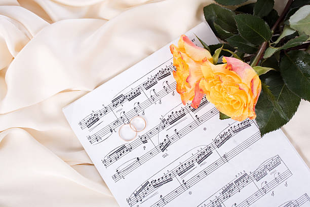istock Bouquet of Roses, wedding rings on Silk 178639782