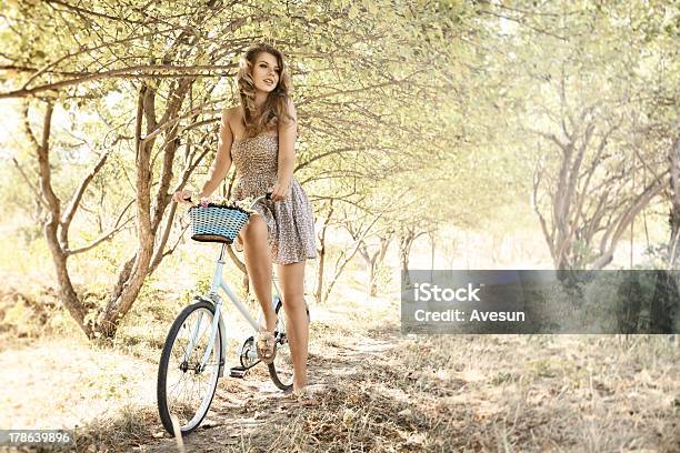 Young Woman With Bicycle In A Park Stock Photo - Download Image Now - 20-29 Years, Activity, Adult