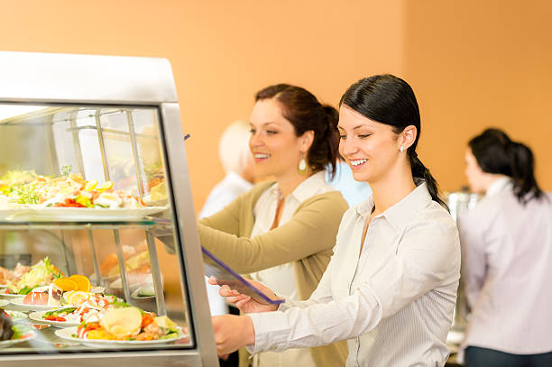 istock Cafeteria lunch young woman take salad plate 178640566