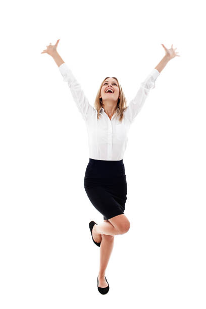 Pretty young woman with arms raised isolated Excited young woman smiling isolated on white background arms raised women business full length stock pictures, royalty-free photos & images