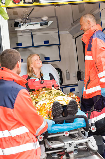 istock Emergency doctor with woman in ambulance 178641079