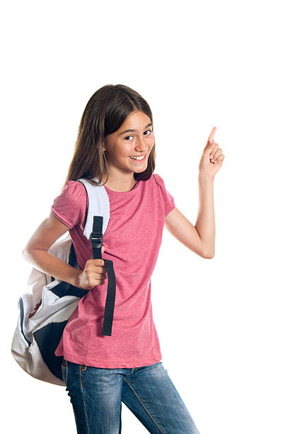 niña en edad escolar señalando con - schoolgirl pre adolescent child school children book bag fotografías e imágenes de stock