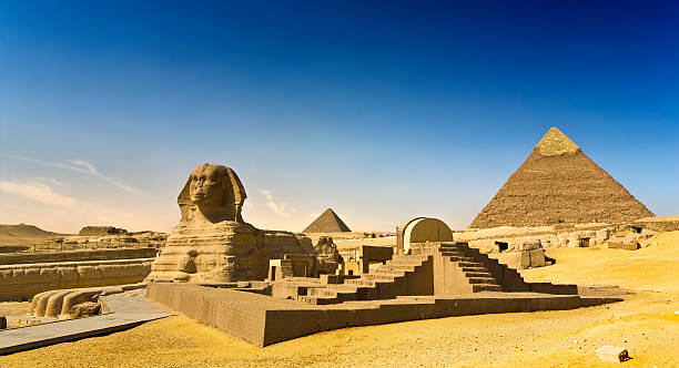 The Great Sphinx of Giza Egypt. Cairo - Giza. The Sphinx; the Pyramid of Khafre (Chephren) and Menkaure (Mykerinos) in background. The Pyramid Fields from Giza to Dahshur is on UNESCO World Heritage List giza stock pictures, royalty-free photos & images