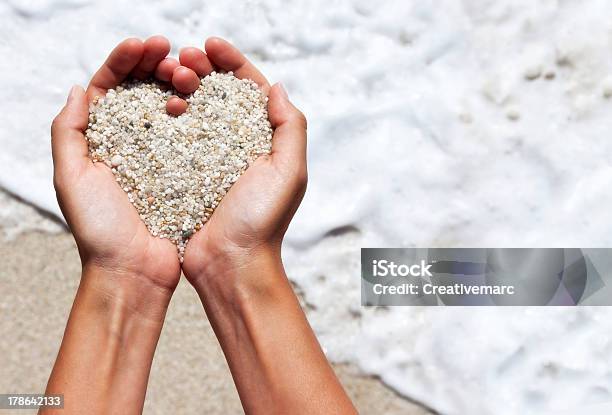 Mellow Heart Shaping Female Hands Above Beach Stock Photo - Download Image Now - Sand, Heart Shape, Beach