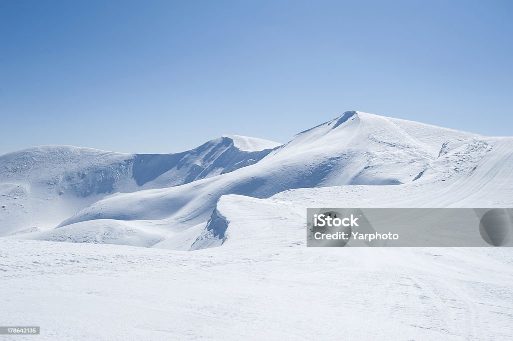 Mountains of snow Winter snow covered mountain peaks in Europe. Great place for winter sports Mountain Stock Photo