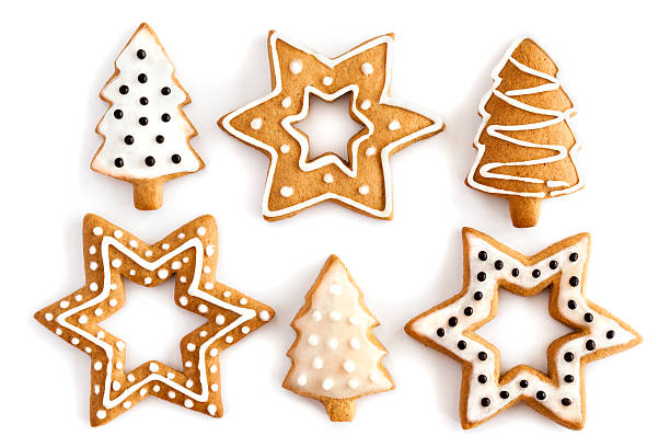 Ginger Christmas cookies with white and black icing "Christmas Ginger and Honey cookies on isolated white background. Star, fir tree, snowflake shape." Christmas Tree Cookie stock pictures, royalty-free photos & images