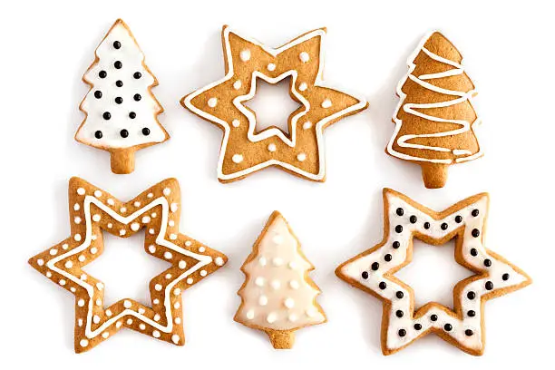 "Christmas Ginger and Honey cookies on isolated white background. Star, fir tree, snowflake shape."