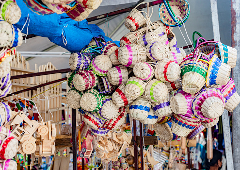 Handbags, dolls and bracelets in street market