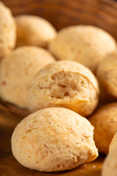 istock Cheese bread, basket with cheese bread arranged on rustic wood, dark background, selective focus. 1786454626