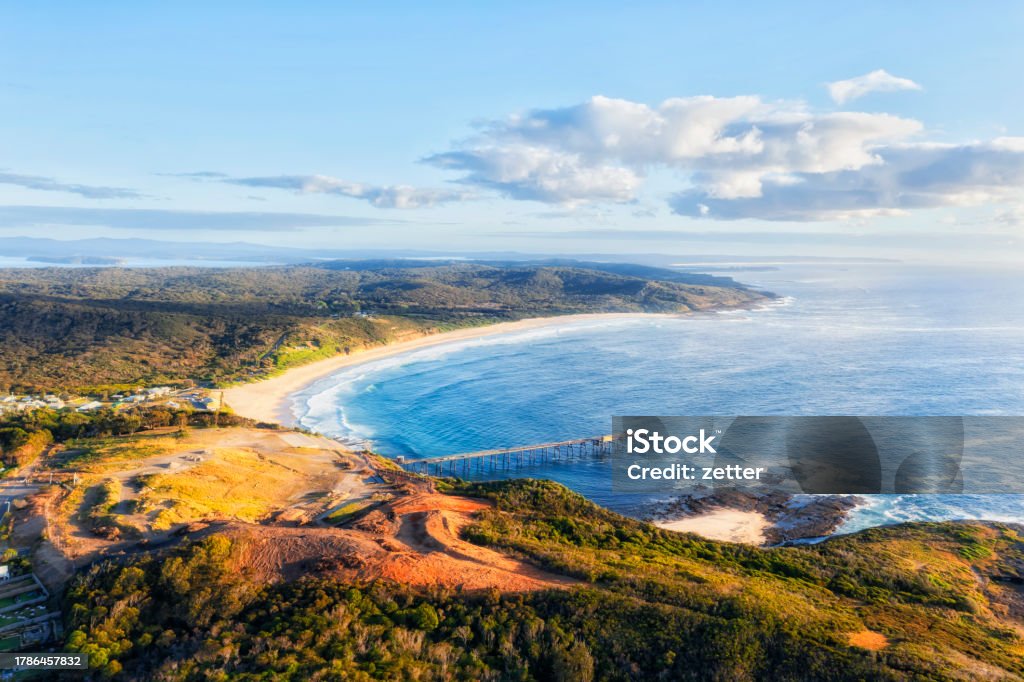 D CHB Beach head to north east Scenic aerial landscape of Catherine hill bay coastal town in Australia on Pacific ocean. Australia Stock Photo