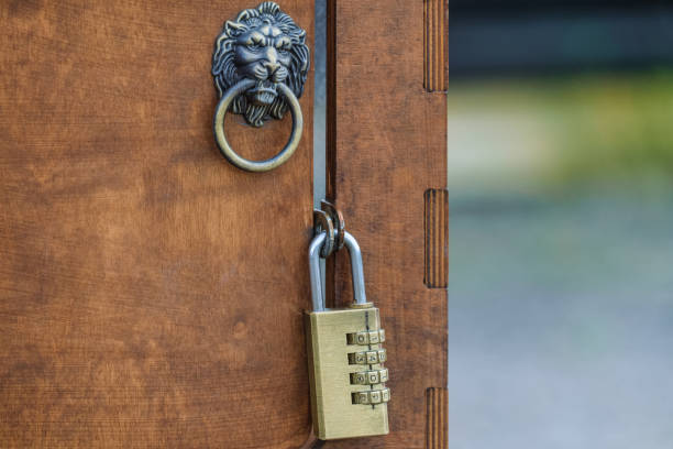 Small wooden door with code lock and furniture handle lion with ring