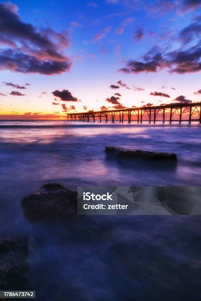 Chb Rocks Dark Jetty Vert Stock Photo - Download Image Now - Australia, Bay of Water, Beach