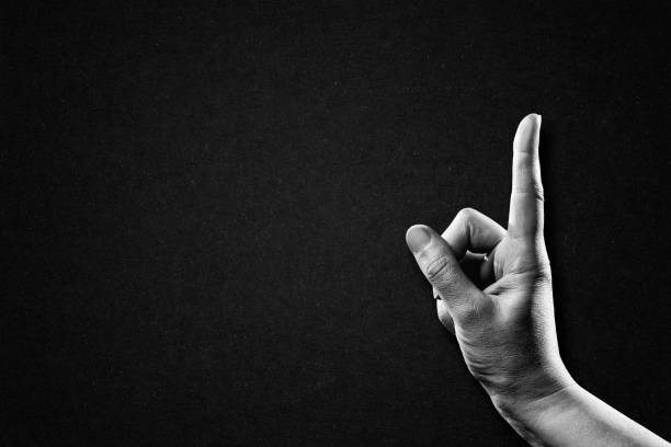 Hand Finger Pointing Sign Hand Finger Pointing Sign in Black and White on Textured Paper Background, Copy Space black and white instant print stock pictures, royalty-free photos & images