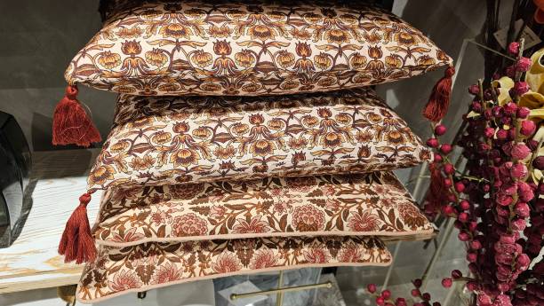 istock A stack of colorful sofa cushions on the shelf. 1786489693