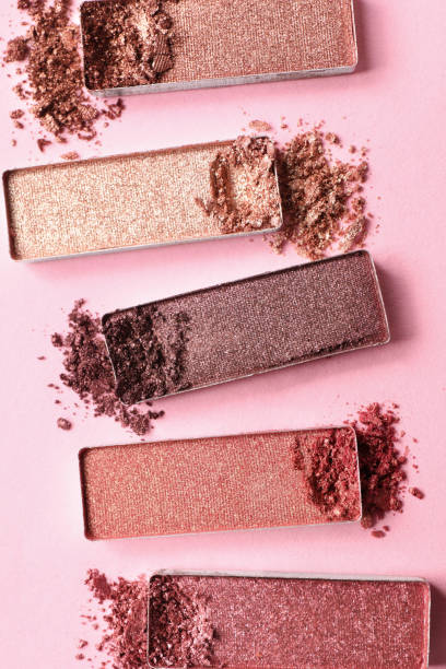istock Different crushed eye shadows on pink background, flat lay. Professional makeup product 1786552066