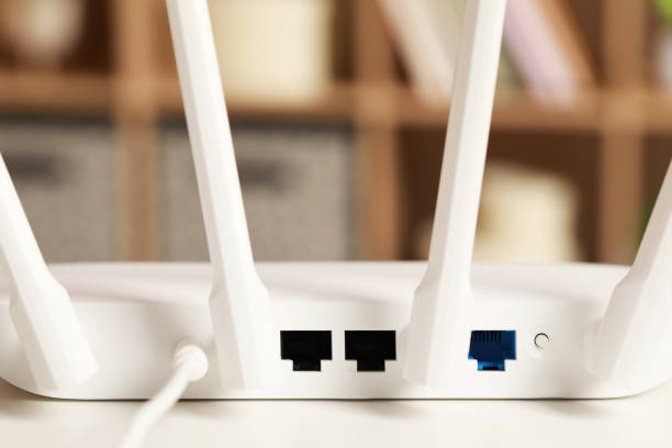 istock New Wi-Fi router on white table indoors, back view 1786562490