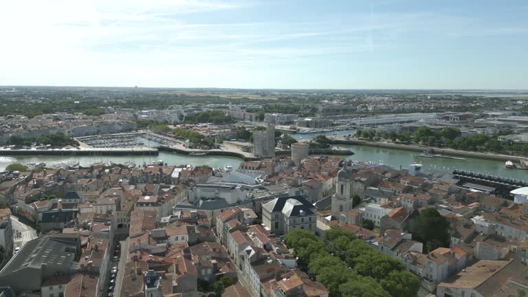 La Rochelle cityscape in France, port and old tower in background. Aerial sideways
