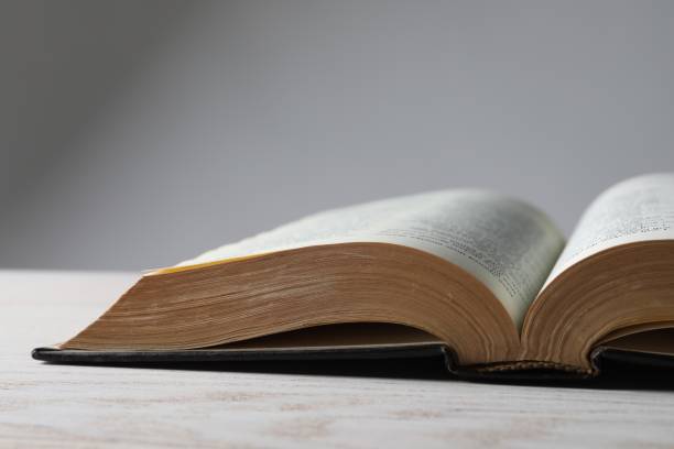 istock Open Bible on wooden table, closeup. Christian religious book 1786577816