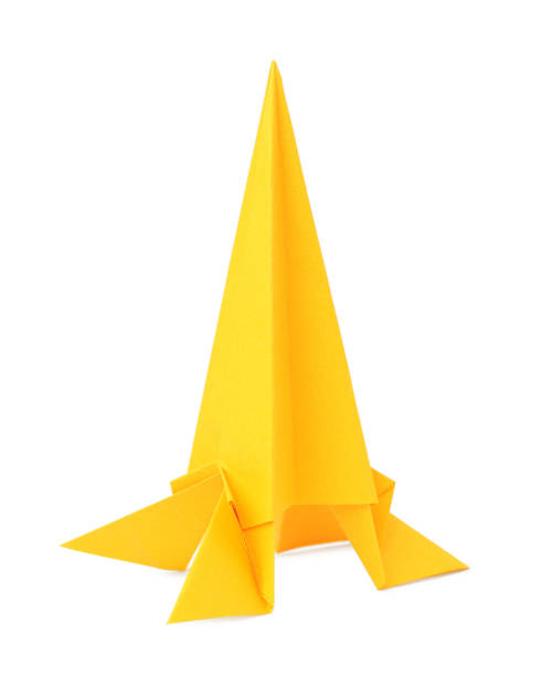 istock Origami art. Handmade yellow paper rocket on white background 1786578331