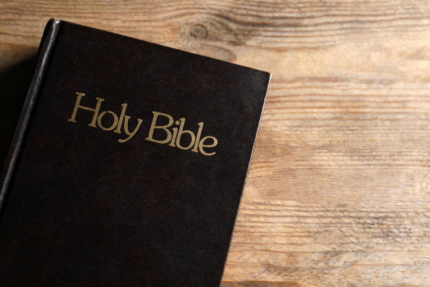 istock Bible on wooden table, top view with space for text. Christian religious book 1786578338