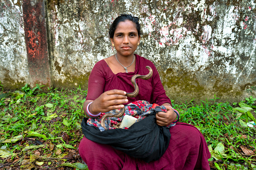 A gypsy healer from Bangladesh shows her healing horn with which she will heal her patient