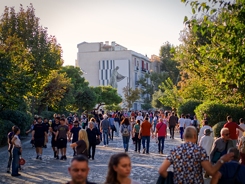 Athens, Greece - November 5, 2023: Plaka Dionysiou Aeropagitou street full of people near Acropolis museum, Athens, Greece